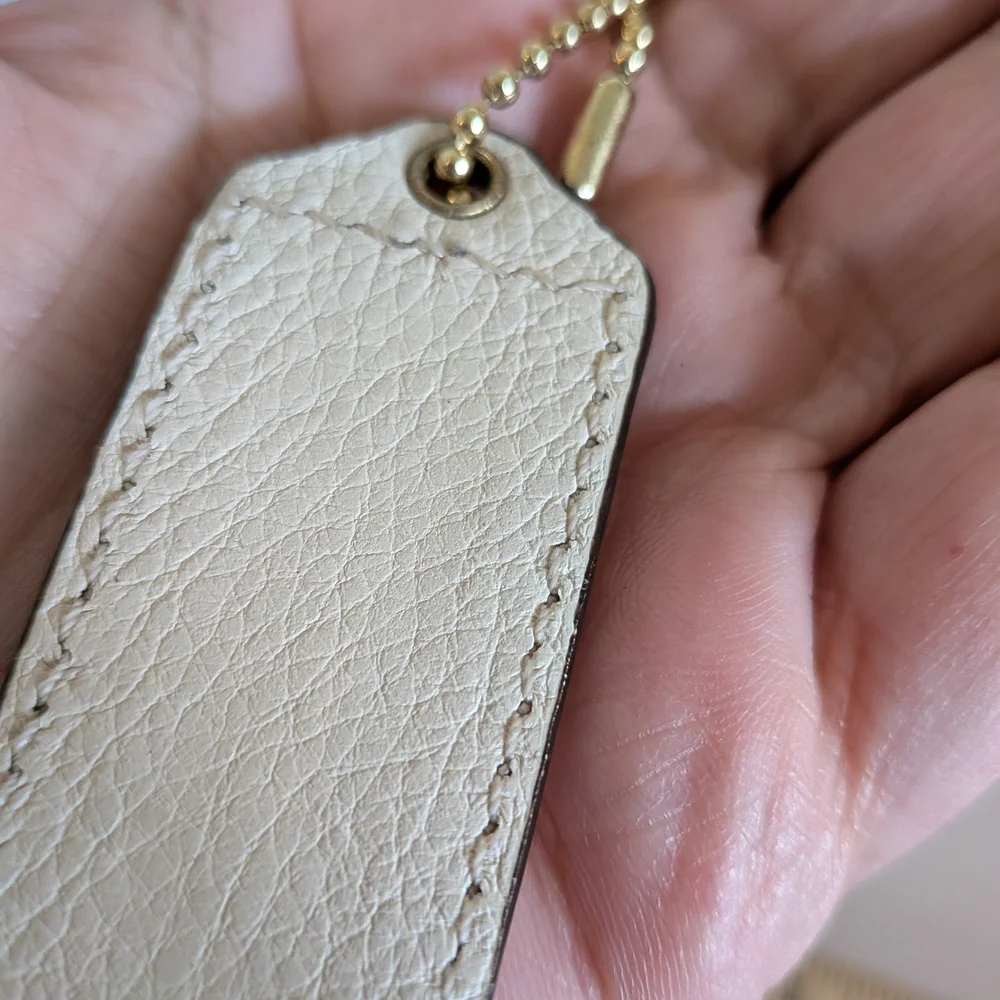 Coach White Pebbled‎ Leather Hang Tag in Cream with Gold Chain